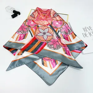 Detail view of 90cm silk scarf with bohemian floral patterns and dreamcatcher design