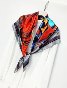 Classic horsebit and chain print satin silk scarf styled on a white shirt collar