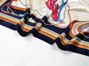 Detailed close-up of silky satin scarf with vintage belt chain patterns and cream navy colors