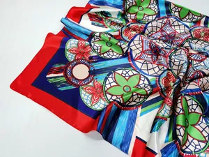 Detailed view of colorful abstract floral pattern on 90cm silk scarf with glossy texture