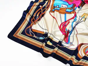 Detailed close-up of 90cm silk scarf with equestrian horse chain and buckle patterns