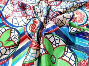 Detailed close-up showing the smooth satin texture and colorful floral pattern of the scarf