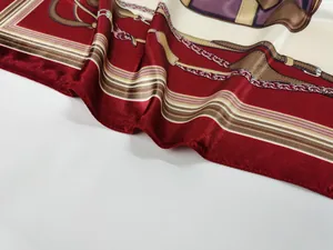 Detail of elegant 90cm silk scarf featuring vintage belt chain patterns and glossy texture