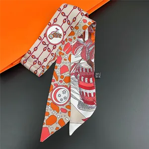 Detail of cartoon floral twilly silk scarf with owl and moon print on orange background