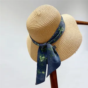 Detailed texture of straw hat weaving with elegant blue floral ribbon tie accessory