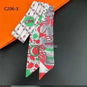 Detail of floral cartoon silk scarf tied as a handle wrap with vivid tropical owl print