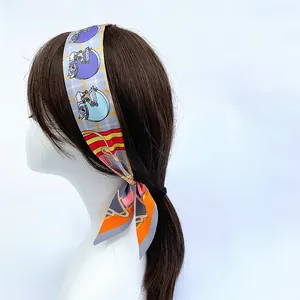 Cartoon horse head print twilly silk scarf tied on model hair for professional styling