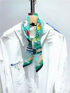 Detail of colorful cartoon pattern silk scarf tied on white shirt collar