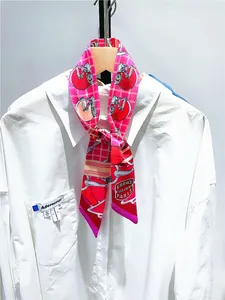 Detail of elegant horse theme twilly silk scarf with France Sellier Paris text on shirt
