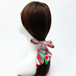 Floral print satin ribbon scarf styled as an elegant hair headband on a mannequin
