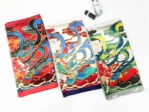 Three Dunhuang flying goddess silk scarves in red, beige and grey with smooth satin luster