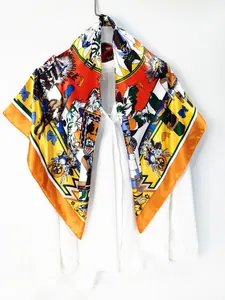 Detail of vibrant 90cm silk shawl with colorful folk illustration on a white shirt
