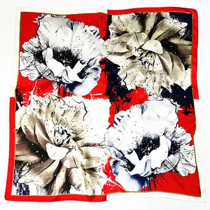 Red and black floral square silk scarf with gold dots on a white background