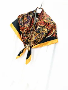 Close-up of Baroque palace style silk scarf with vintage gold and royal blue patterns