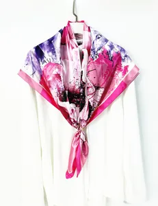 Artistic floral square silk scarf with vibrant abstract print and gold buckle detail