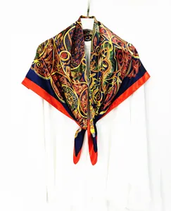 Close-up of vintage baroque paisley silk scarf tied on a white shirt collar