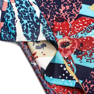 Detailed view of sunflower floral scarf fabric with leopard print and hemmed edges