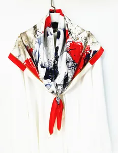 Close-up of abstract artistic flower silk scarf with modern ink splash pattern and gold buckle