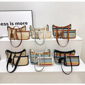 Detailed set of rainbow woven straw bags with leather straps in six assorted colors