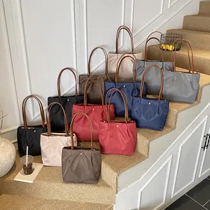 Waterproof nylon tote bag with leather handles in multiple colors for daily use