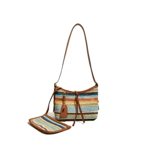 Rainbow striped woven straw tote bag with matching pouch and brown leather straps