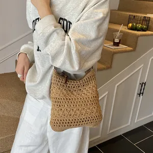 Handcrafted woven straw shoulder bag with zipper closure for summer beach vacations
