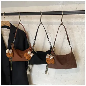 Three minimalist underarm bags in brown, black and dark coffee with cute dog charms