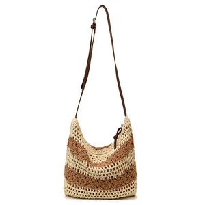 Large woven shoulder bag with beige and brown stripes and adjustable leather strap