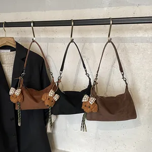 Retro suede hobo shoulder bags in black and brown colors with cute teddy bear charms