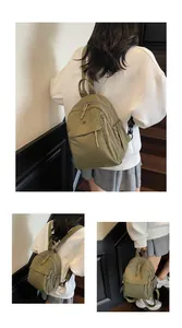 Détail du sac à dos vintage vert olive avec plusieurs poches zippées et poches latérales