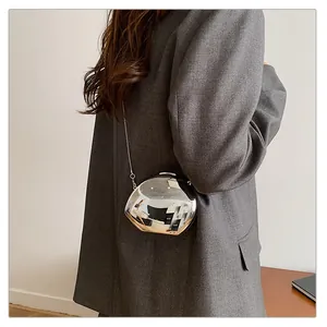 Detailed view of a silver mirror evening bag with elegant metal chain strap for women