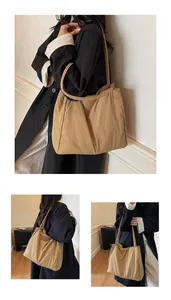 Close-up of khaki tote bag showing nylon texture and spacious minimalist interior design