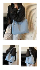 Detailed views of light blue quilted tote bag showing large capacity and soft nylon texture