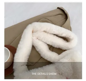 Close-up of wide faux fur shoulder strap on off-white plush bag for comfort