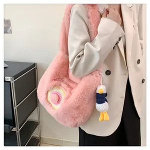 Pink plush tote bag featuring donut embroidery and a knitted duck charm detail