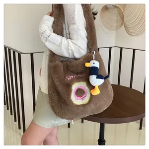 Deep brown faux fur tote bag featuring donut embroidery and a cute seagull plush charm