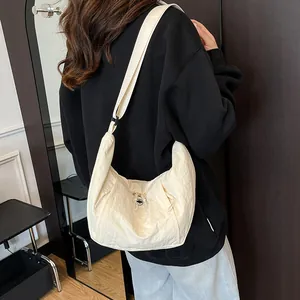 Minimalist beige pleated crescent crossbody bag with adjustable strap for women