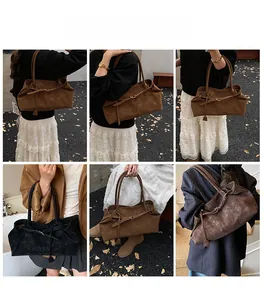 Showcase of large vintage oil wax leather tote bag worn as a shoulder and underarm bag