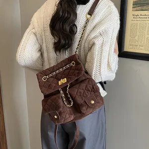 Quilted brown velvet backpack with golden twist locks and chain straps for women
