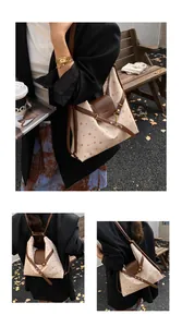 Detail of polka dot canvas bag showing leather trim and adjustable strap texture