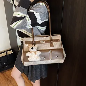 Retro patchwork tote bag with teddy bear charm and marble texture, shown on model