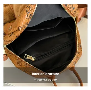 Internal structure of the brown backpack with zipper pocket and dual open compartments