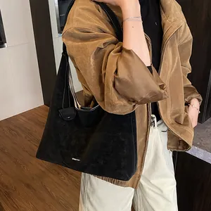 Minimalist black faux suede large tote bag for women shown with casual autumn outfit