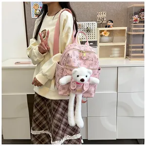 Pink printed PU backpack with a cute long-legged white plush bear doll on the front