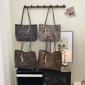 Set of leopard print tote bags in various colors with bead charms and long straps
