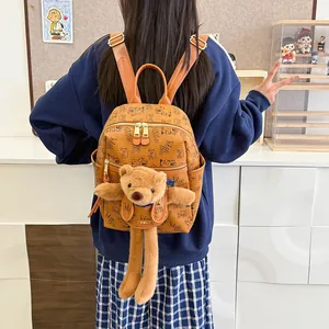 Stylish brown letter print backpack with cute plush bear pendant and leather straps