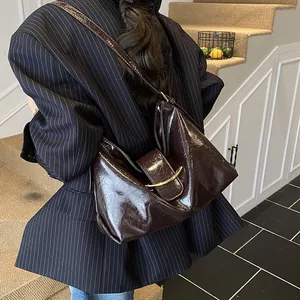 Minimalist vintage dark coffee underarm bag with oil wax leather texture and golden buckle