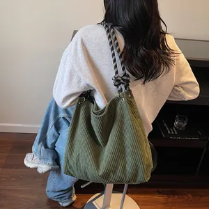 Green corduroy crossbody bag with black and white rhombus pattern rope strap for women
