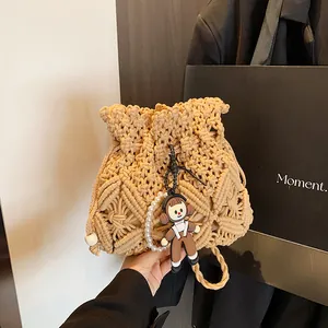 Handmade Woven Straw Bucket Bag For Women Fashion Crossbody Shoulder Bag With Pearl Cartoon Doll Pendant Beach Vacation Travel Handbag