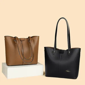 Minimalist litchi grain leather tote bags in brown and black with gold logo